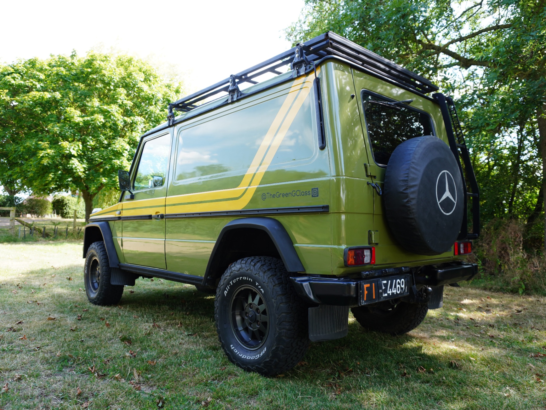 Rear three-quarter with roof rack and spare