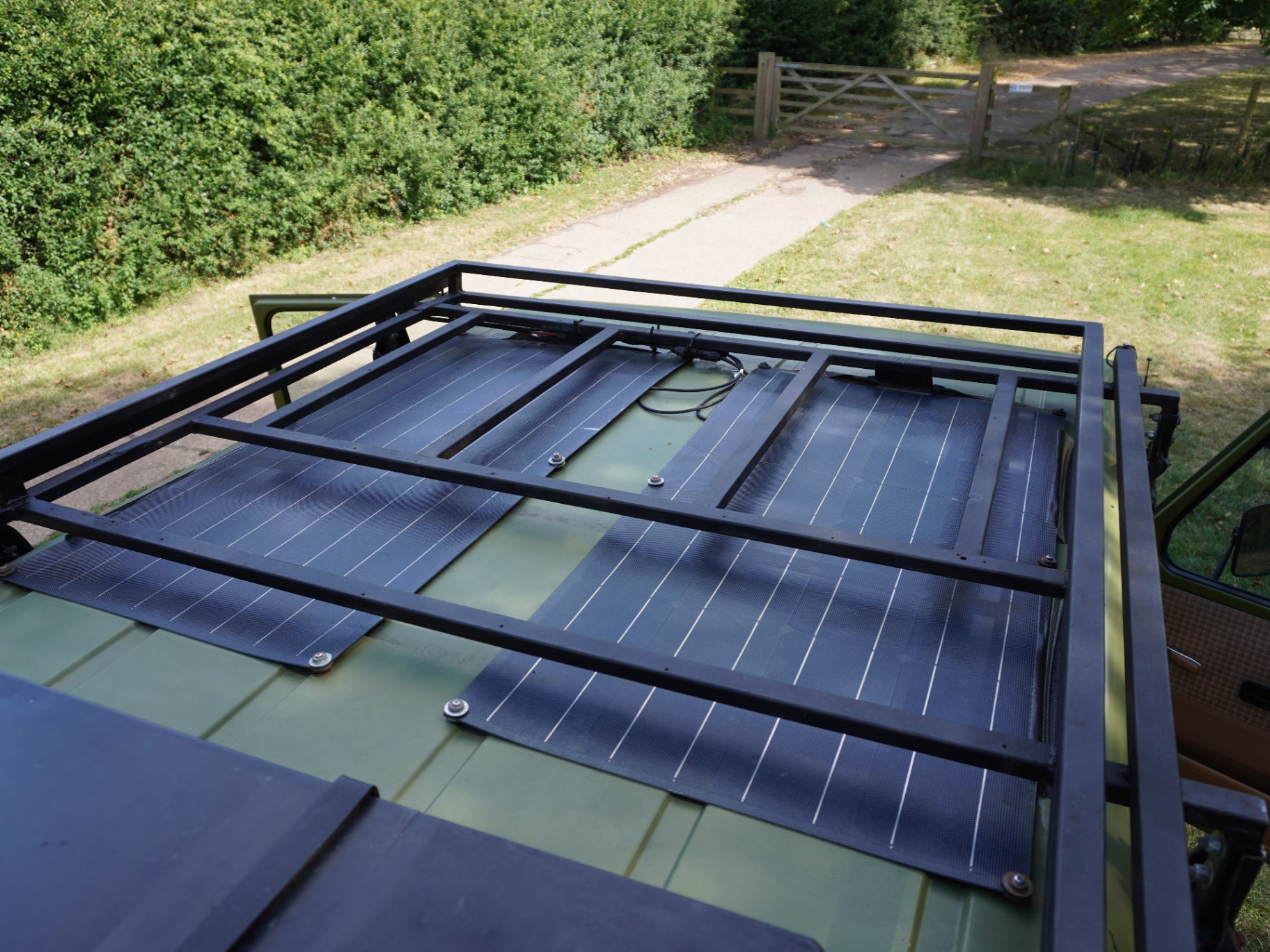 Roof rack with flexible solar array