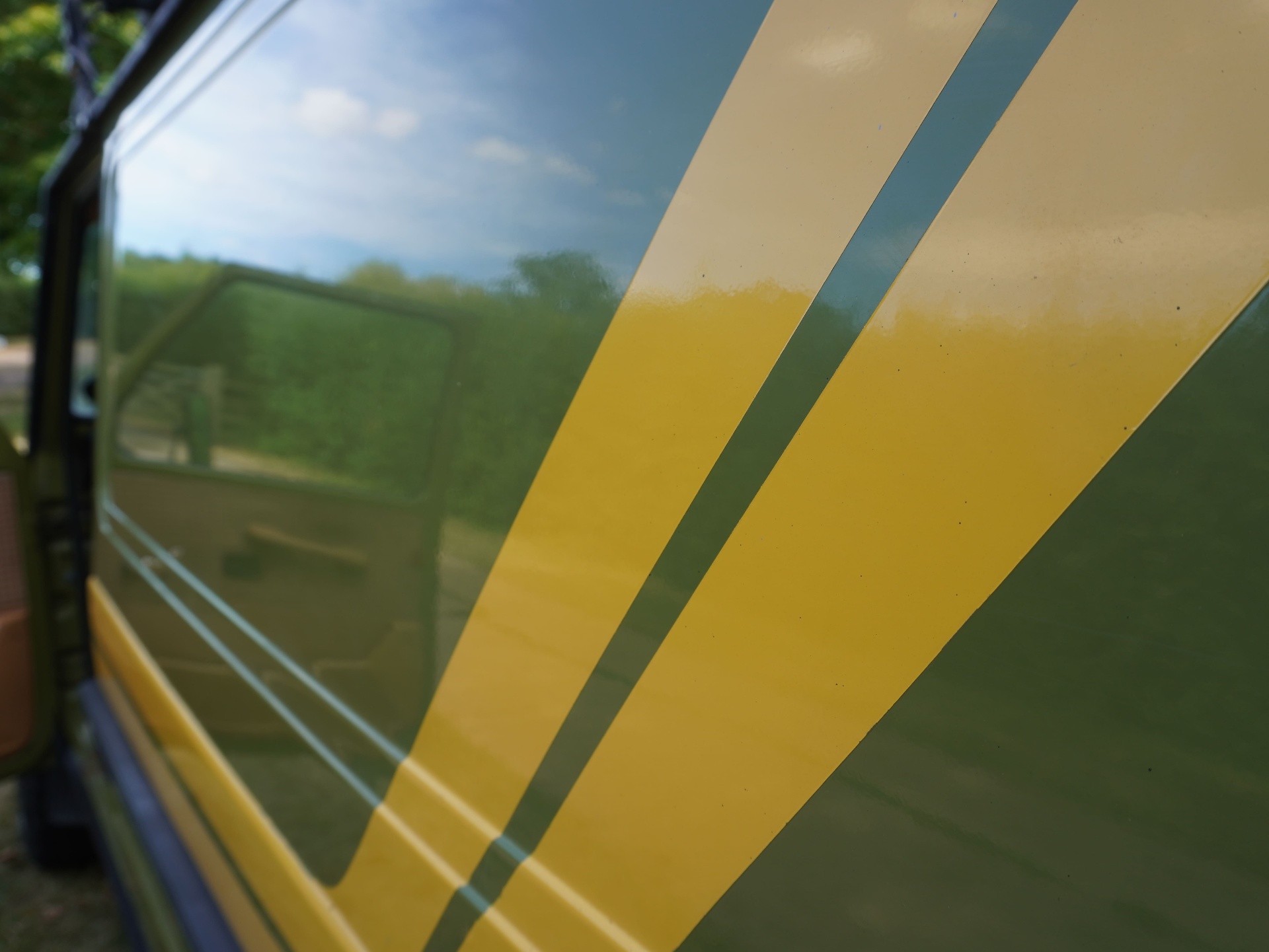 Yellow accent stripes and paint detail on door