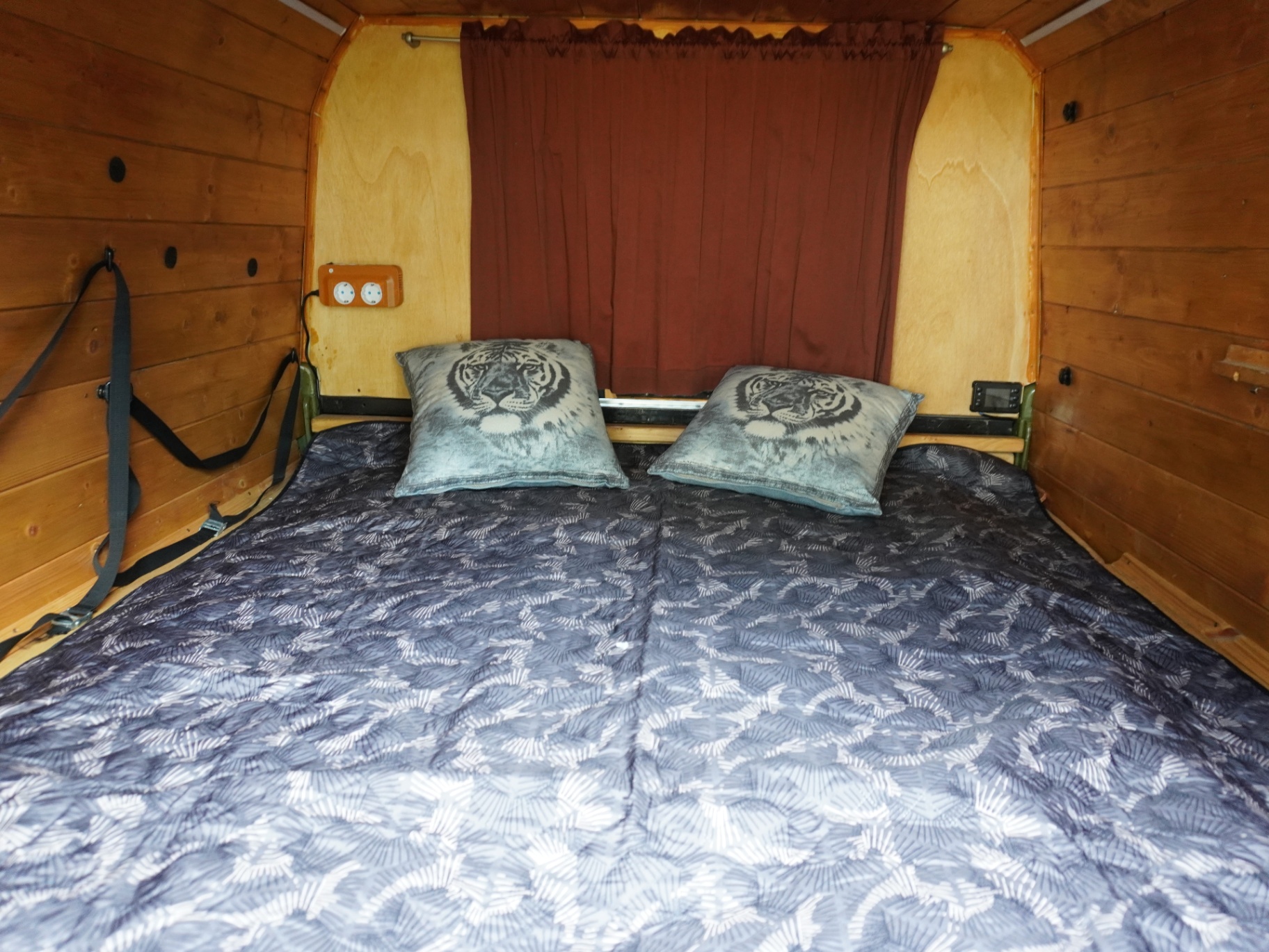 Bed made up - full-width sleeping platform with cushions