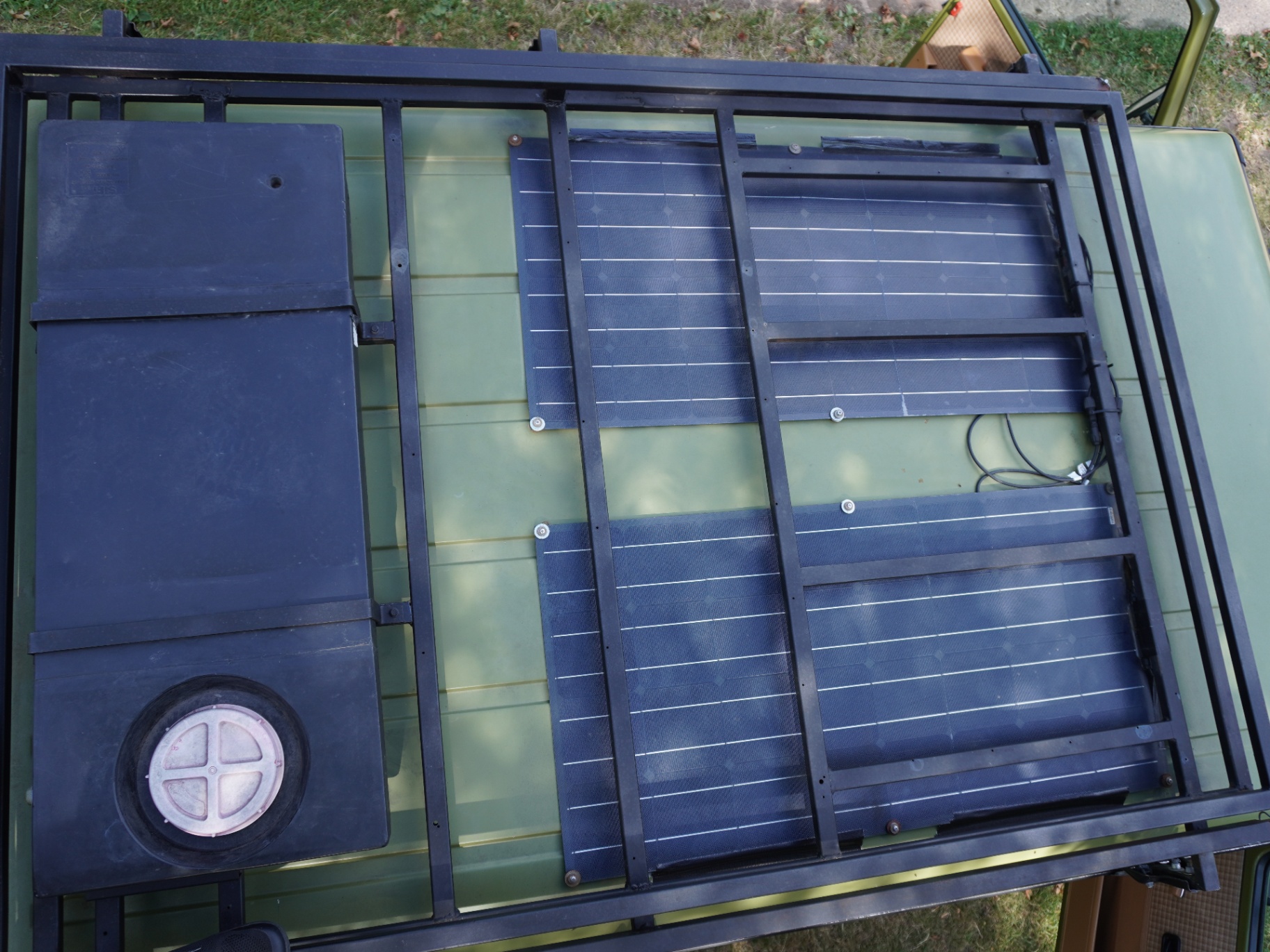 Solar panels, water tank and vent from above