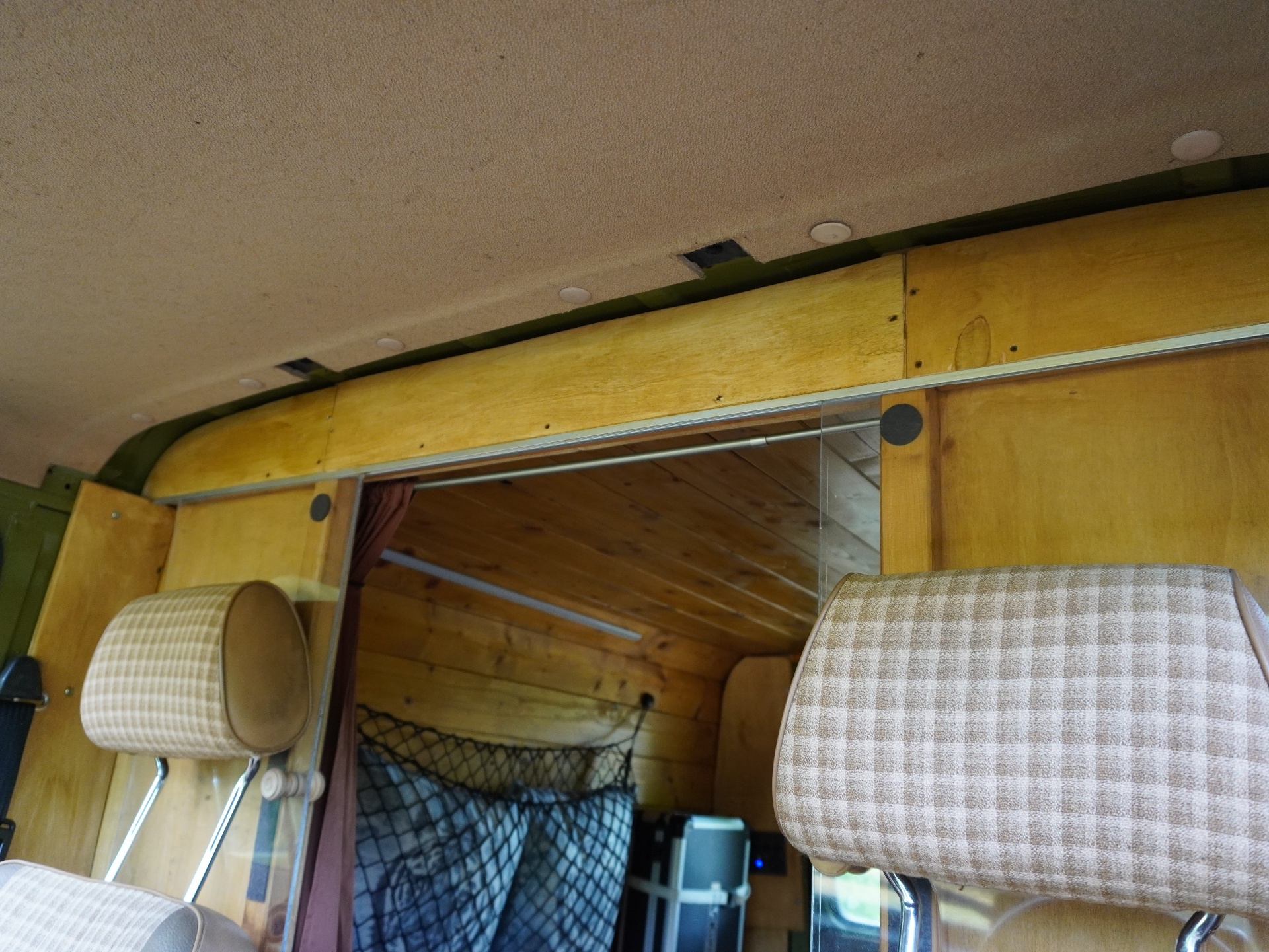 Sliding glass partition between cab and camper
